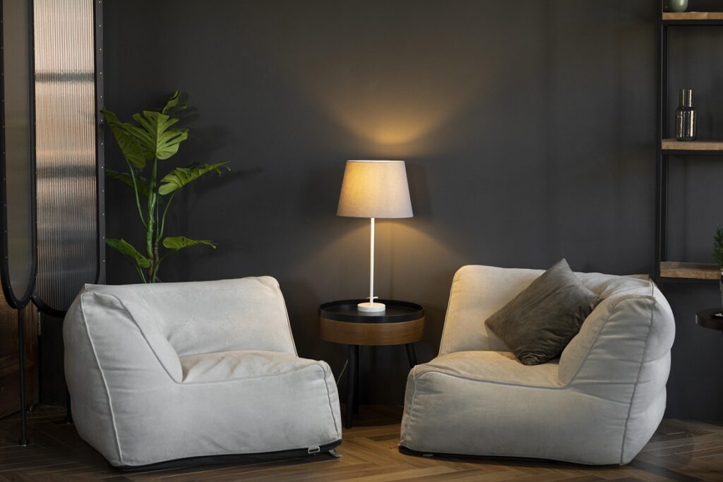 Lighting sets the mood of a room. Relying solely on overhead lighting can create harsh shadows. Consider using a mix of task, ambient, and accent lighting.