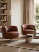 Two cognac ZEPPOLA leather armchairs in a stylish living room